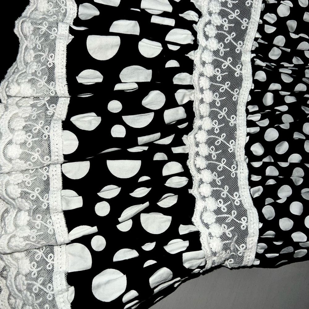 Tiered polka dot gown.